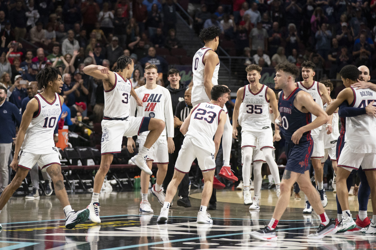 March 8, 2022; Las Vegas, NV, USA; Gonzaga Bulldogs celebrate after defeating the Saint Mary's Gaels after the game in the finals of the WCC Basketball Championships at Orleans Arena.